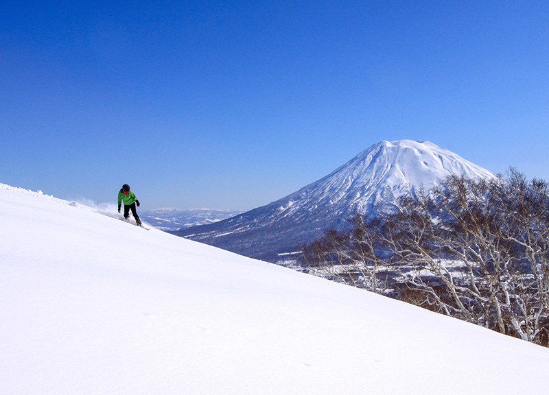 Snowboarder on detox holiday boards down a ski slope in Sapporo, Japan