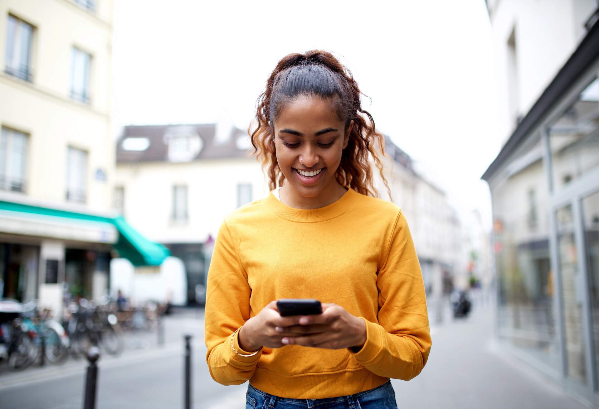 happy girl watching phone