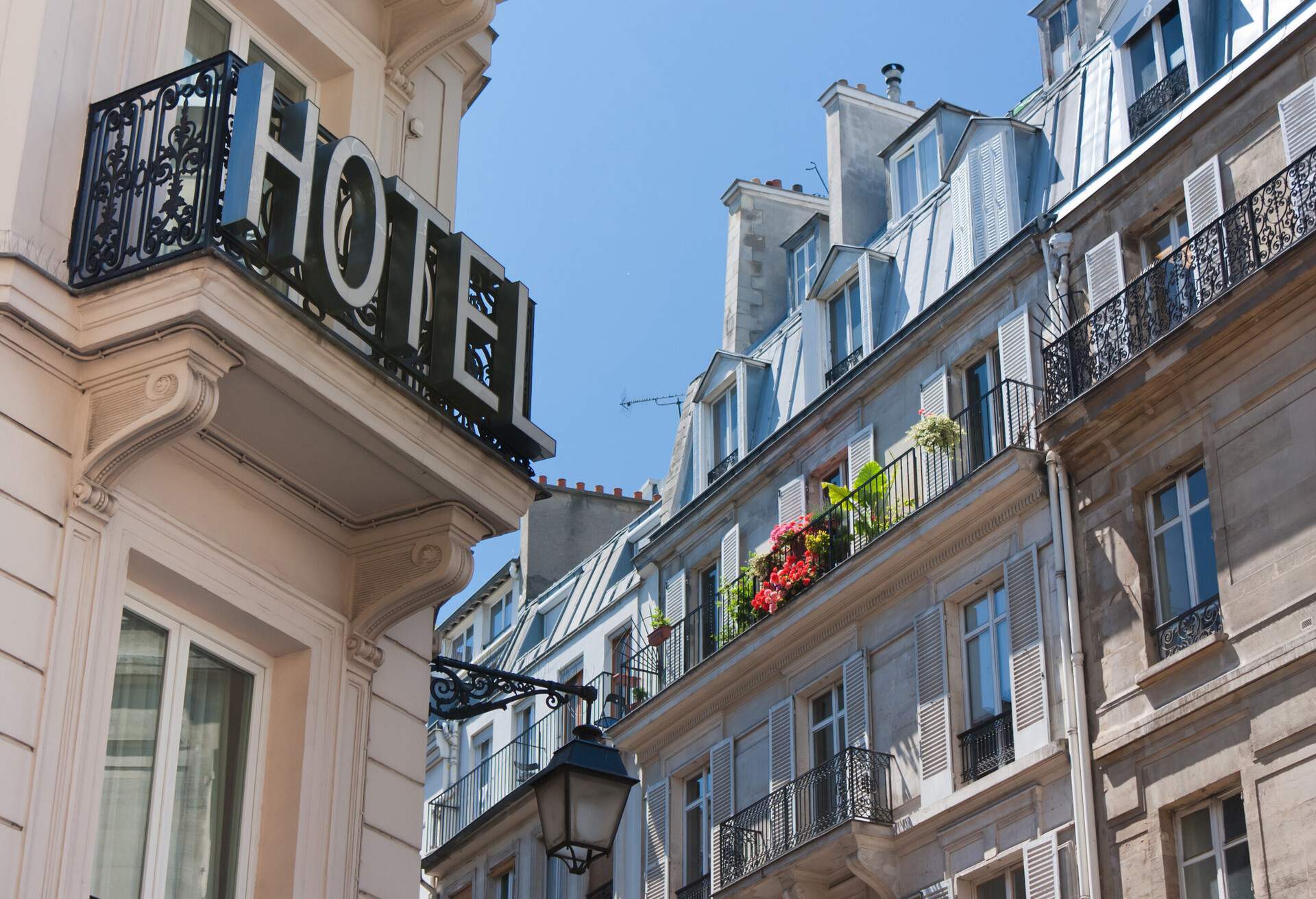 Hotel signage hung on the balcony's wrought iron railing.